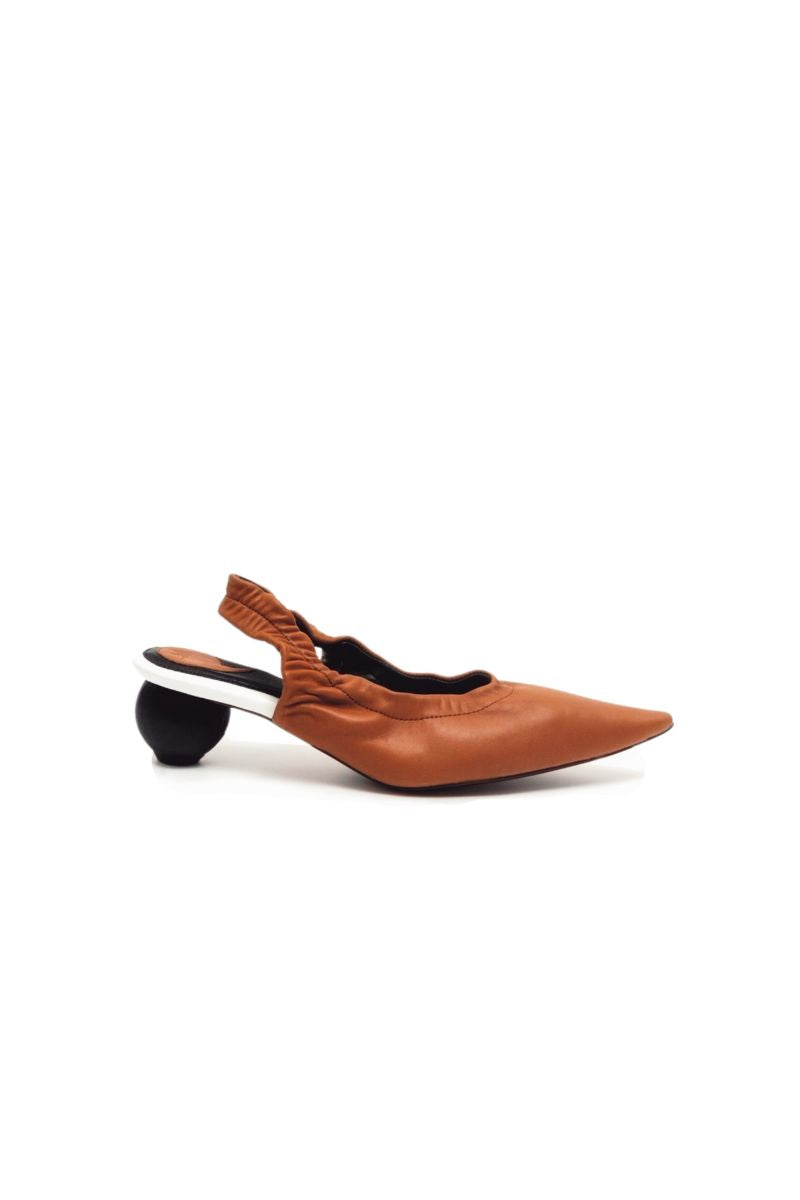 Christin Wu Phoebe caramel sling-back heels with pointed toes and elegant strap design, shown from a side view.