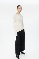 Dāl the Label modal asymmetric knit top featuring a stylish, modern design with a relaxed fit and soft fabric.
