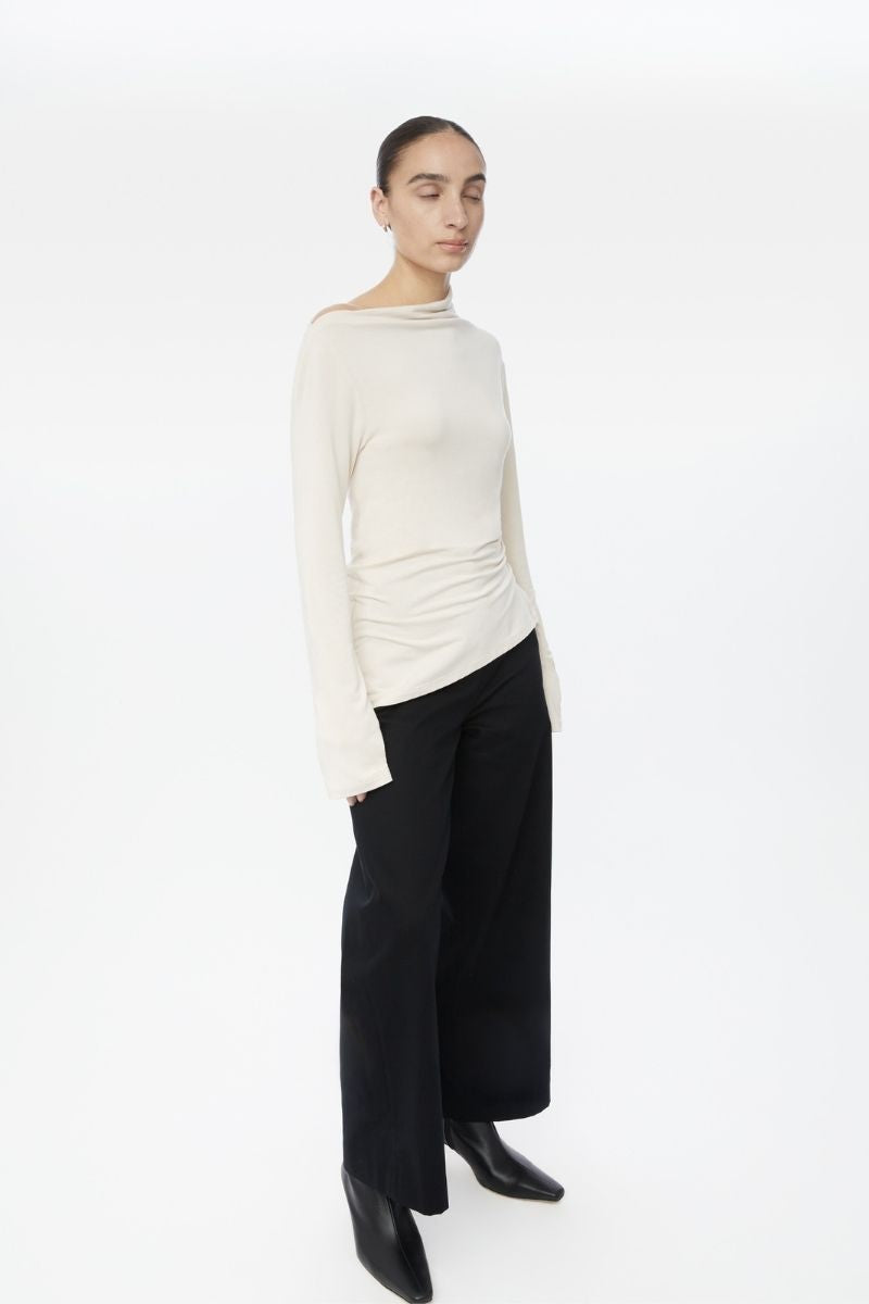 Dāl the Label modal asymmetric knit top featuring a stylish, modern design with a relaxed fit and soft fabric.