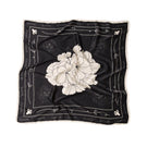 Señorita black Luisa scarf with soft fabric, stylish accessory for outfits, shown draped neatly on a flat surface.