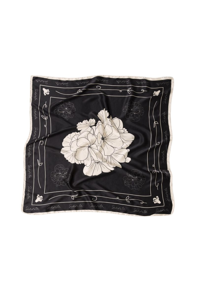 Señorita black Luisa scarf with soft fabric, stylish accessory for outfits, shown draped neatly on a flat surface.