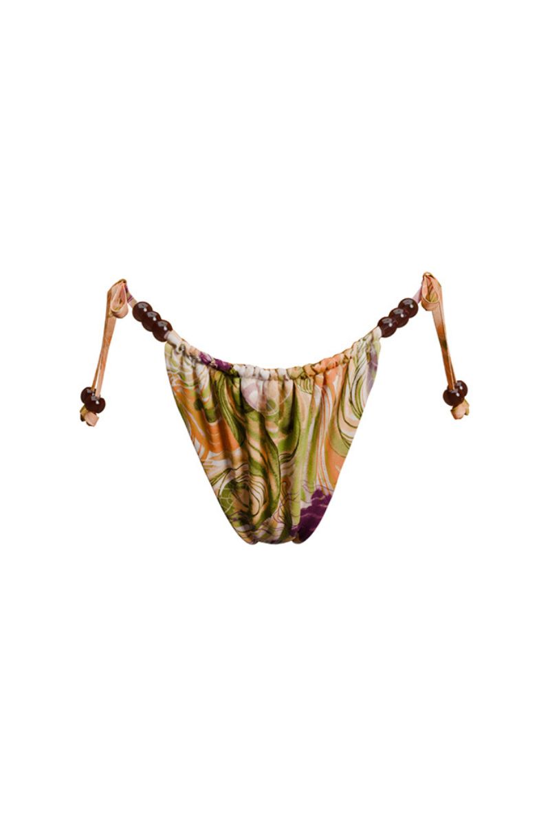 Andrea Iyamah reversible bikini bottom in Vibra print with bright gold accents, featuring a vibrant, colorful design.