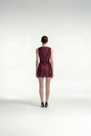 Burgundy lace-up mini dress by Tayfun Kaba featuring intricate lace details and a fitted silhouette.