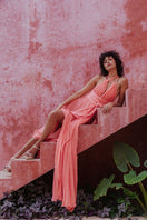 Kasia Kulenty Gisella gown in sorbet color, elegant evening gown with flowing fabric and intricate detailing.