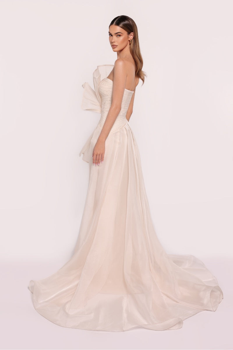 Tarık Ediz Ephesus dress in vanilla, elegant gown with flowing fabric and classic design, perfect for formal occasions.
