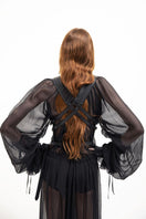 Black leather vest with belt from Vaska, stylish jacket featuring a front buckle and sleek design.