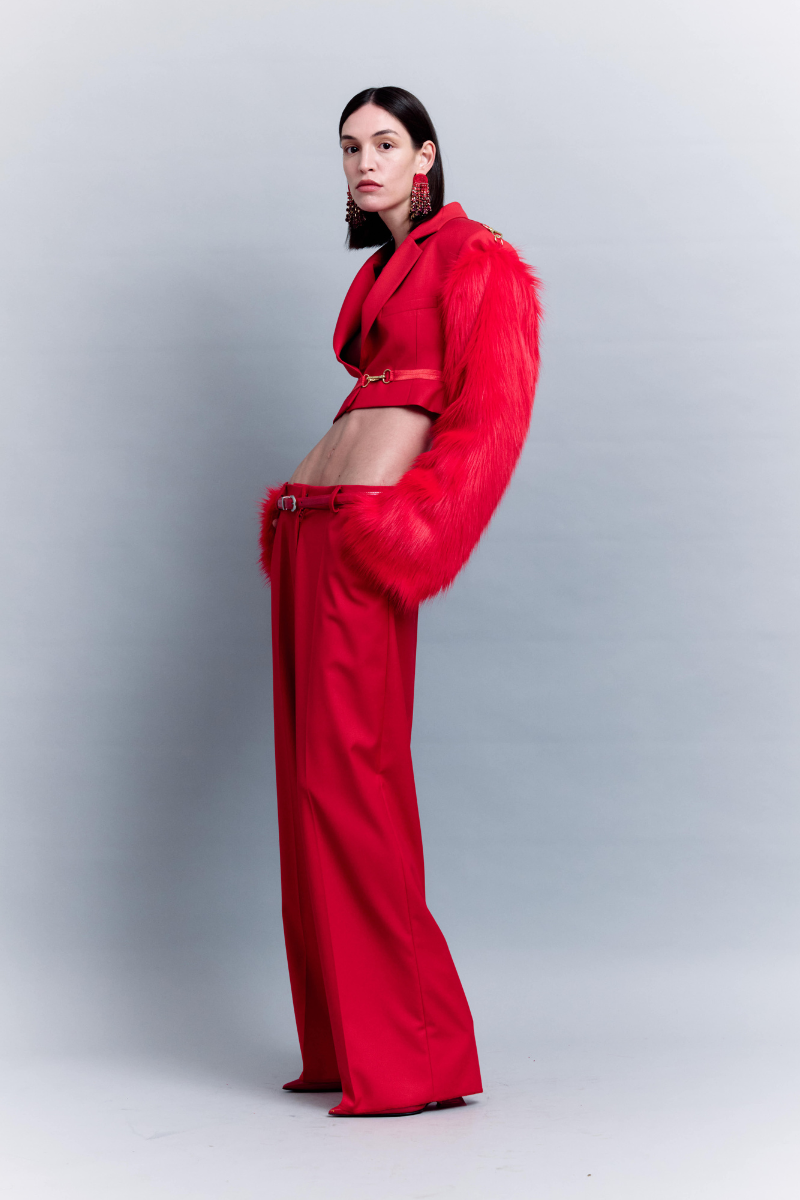 Sudi Etuz low waist straight cut pants in neutral fabric, shown laid flat with waistband and pockets visible.
