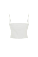 White Ancient Top by Acaria Studio, lightweight women's blouse with intricate design and relaxed fit, shown on a model.