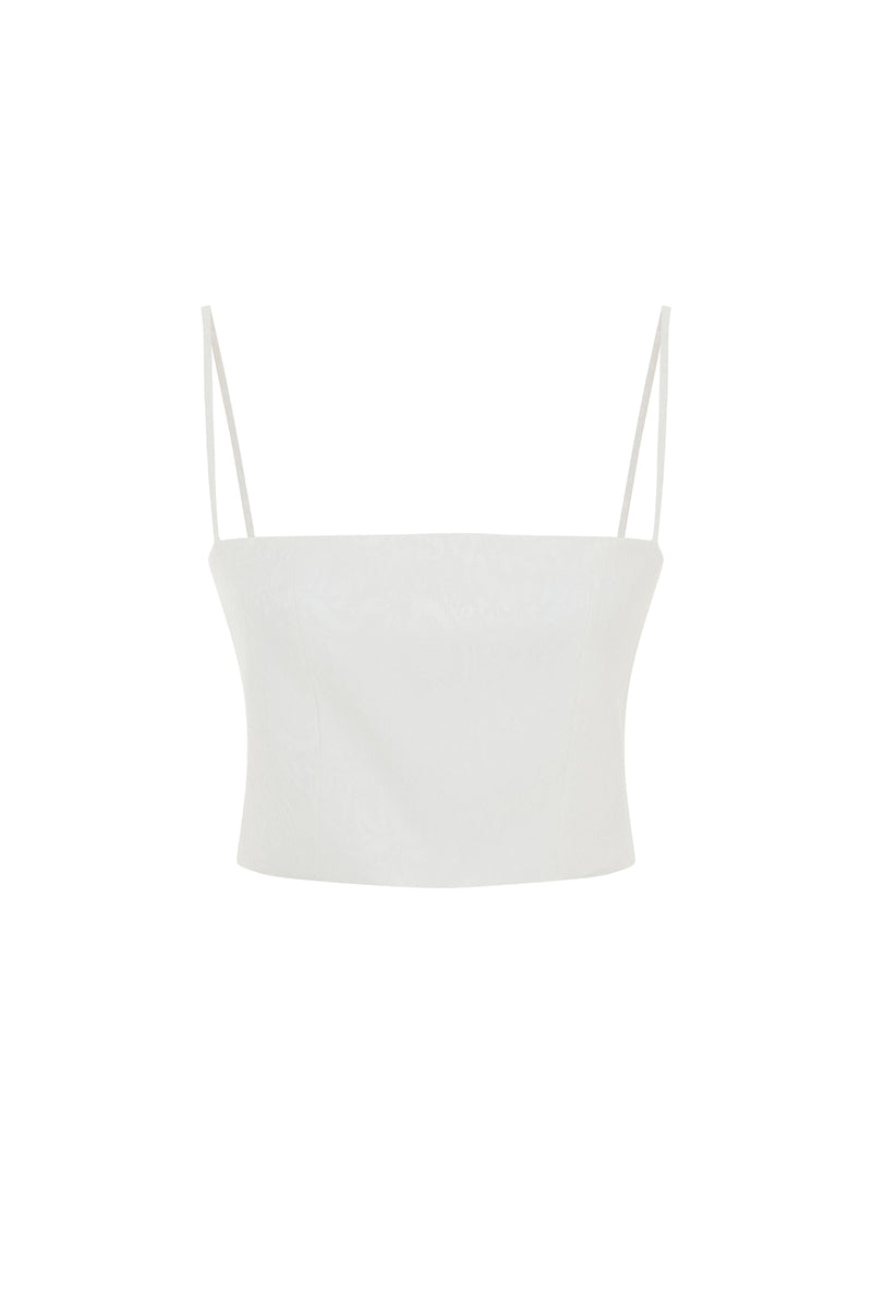 White Ancient Top by Acaria Studio, lightweight women's blouse with intricate design and relaxed fit, shown on a model.