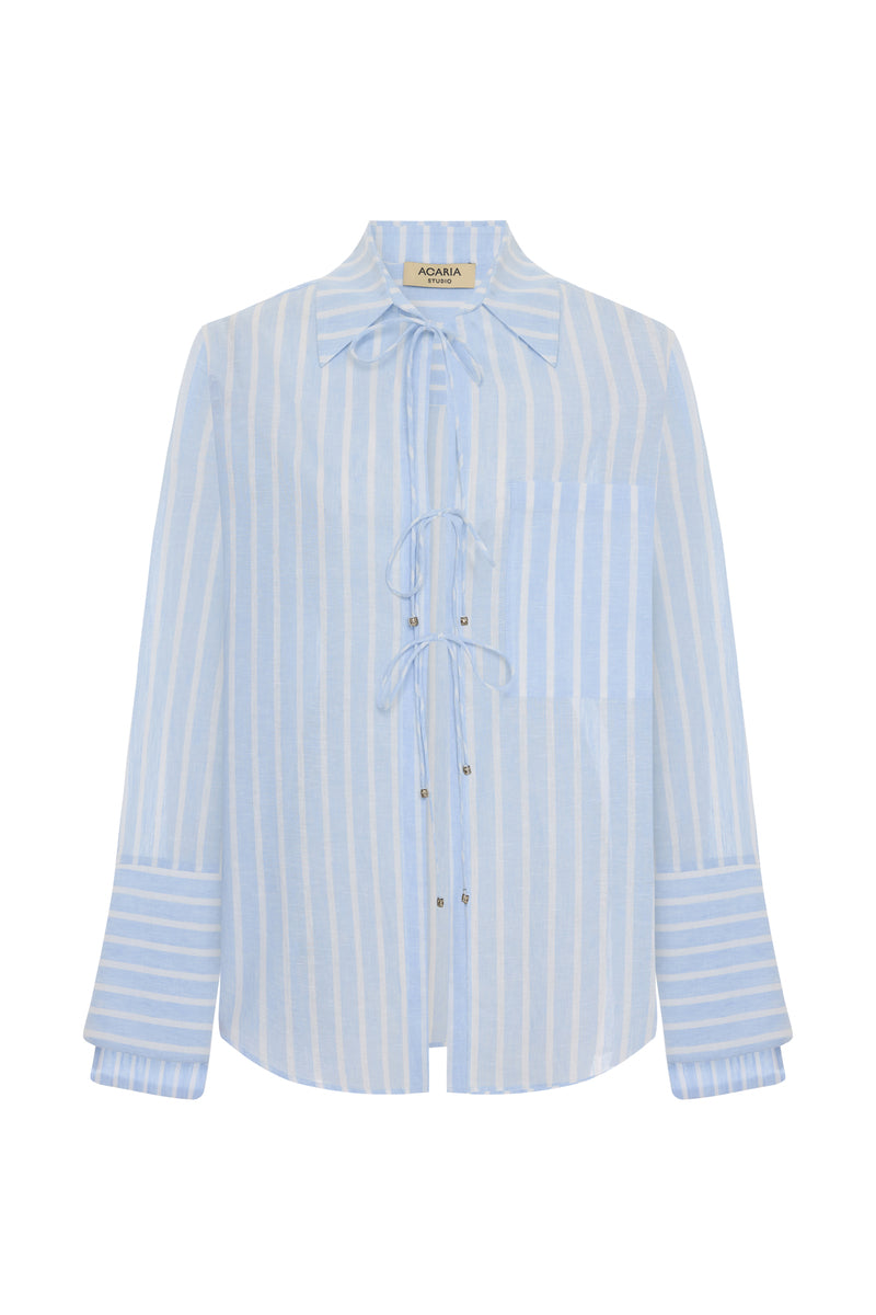 Blue striped Sicilia linen shirt by Acaria Studio, lightweight and breathable, shown on a hanger.