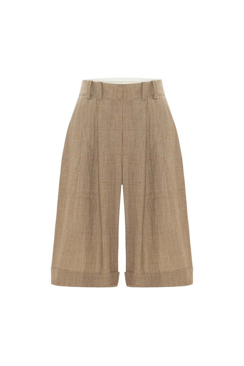 Beige TALIA tailored shorts by Acaria Studio displayed on a neutral background, showcasing their fit and stylish design.
