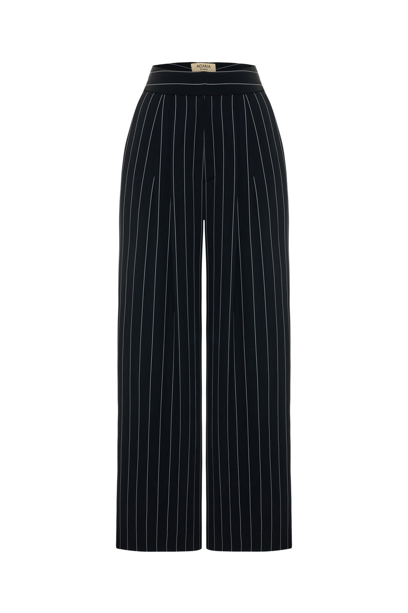 Black and white striped harem pants by Acaria Studio with a relaxed fit and elastic waistband.