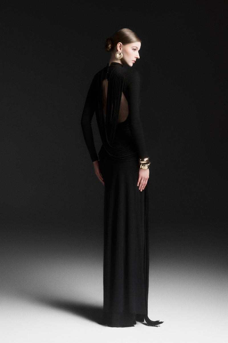 Black Maison Des Copains MIRÉA high neck floor-length maxi dress hanging on a hanger showing its elegant design and flowy fabric.