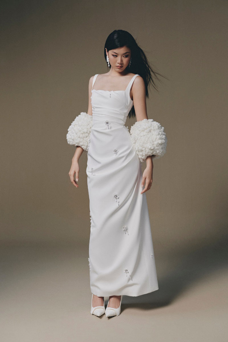 Keira Tong Ripple Maxi Dress featuring flowing fabric, sleeveless design, and vibrant ripple pattern for elegant summer wear.