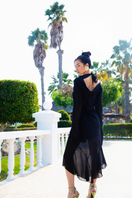 Suncillo Laura midi skirt in flowy fabric with a high waist and elegant drape, shown in a neutral color.