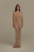 Poem Vespera nude pink gown displayed on a hanger with flowing fabric and elegant design details.