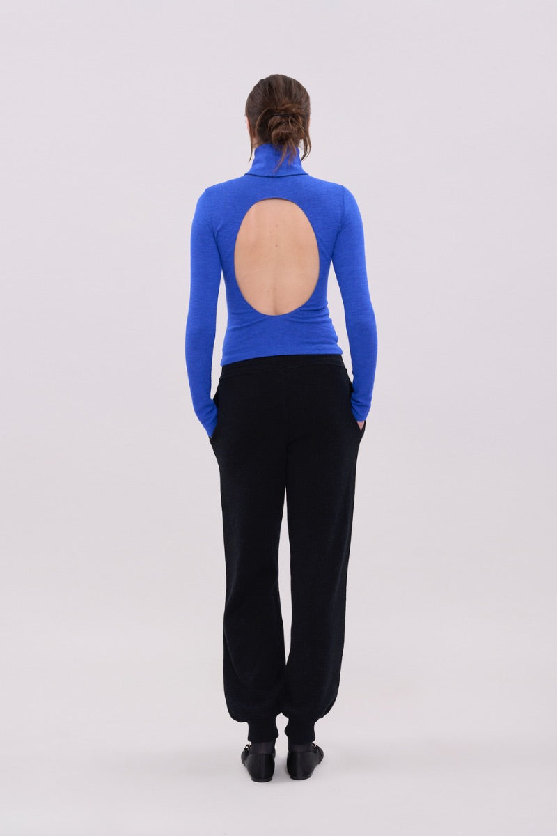 Blue long sleeve top by La Granni featuring a fitted design and soft fabric, shown on a model.