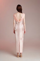 Do Long blush Aurora pink gown with elegant flowing fabric and delicate detailing, perfect for formal occasions.