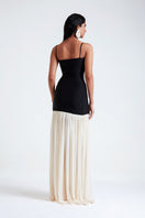 Deme By Gabriella Cara black and white maxi dress with floral pattern, flowing fabric, and sleeveless design.