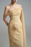 Light tan crystal gown by Happy Clothing featuring intricate crystal embellishments and flowing fabric.