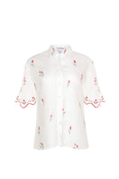 Estefania ivory tulip shirt featuring a flowy fabric and elegant design, displayed flat with detailed collar and sleeves.