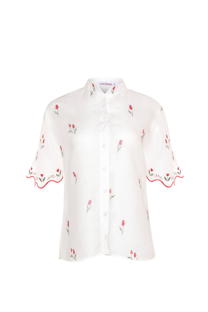 Estefania ivory tulip shirt featuring a flowy fabric and elegant design, displayed flat with detailed collar and sleeves.