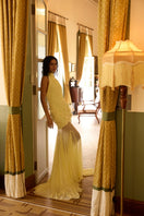 Deme By Gabriella Celeste Maxi Dress in flowing fabric with a floral pattern, sleeveless design, and V-neck style.