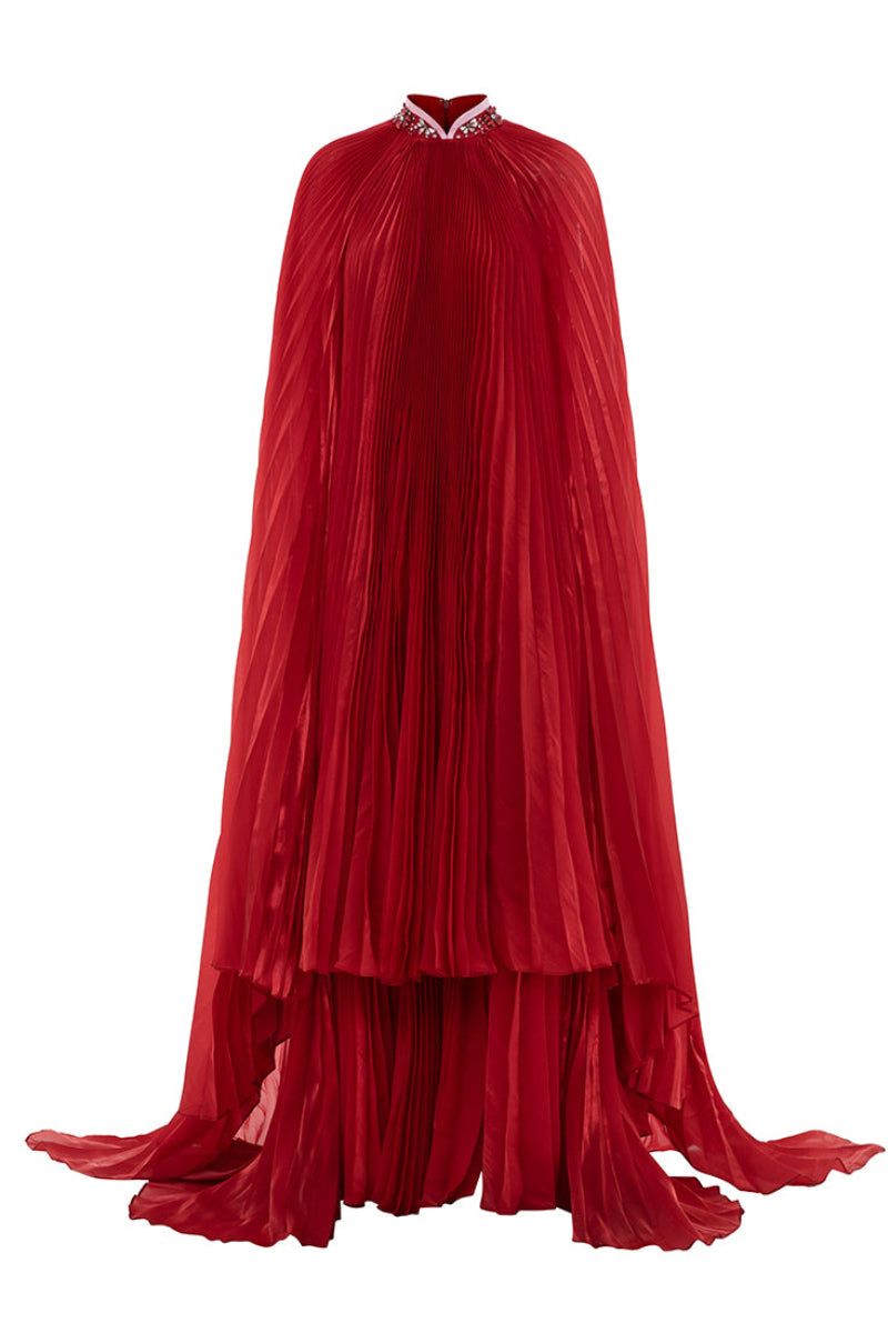 Red Valenciani Sunray pleated high-neck cape gown displayed on a mannequin, showcasing elegant draping and sophisticated design.
