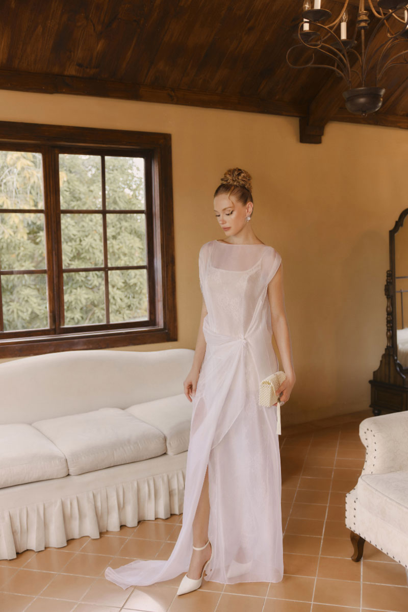 Arti Apparel Bellona Dress, a stylish midi dress in a flowing fabric, shown in a vibrant color with a fitted waist and elegant silhouette.