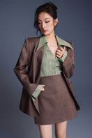 Keira Tong minimal fitted blazer shown on a mannequin, tailored blazer with sleek lapels and a fitted silhouette.