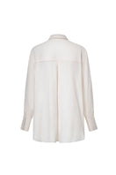 Ivory satin twilly shirt by Levia featuring a smooth, shiny fabric with a stylish tie detail at the collar.
