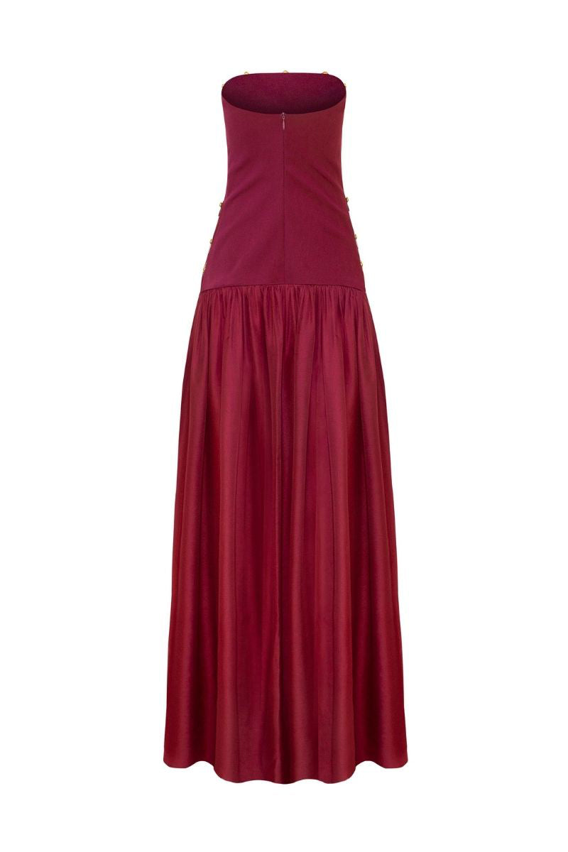 Elegant burgundy Alina gown by LEDIEL, showcasing flowing fabric, fitted waist, and long sleeves perfect for formal occasions.