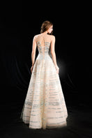 HACCHIC COUTURE Aurelian linear sequin tulle gown in champagne with elegant design and shimmering embellishments.