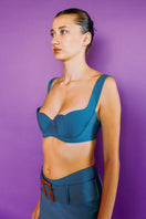 IKINITA Anne blue-green bra top with adjustable straps, soft fabric, and supportive design for a comfortable fit.