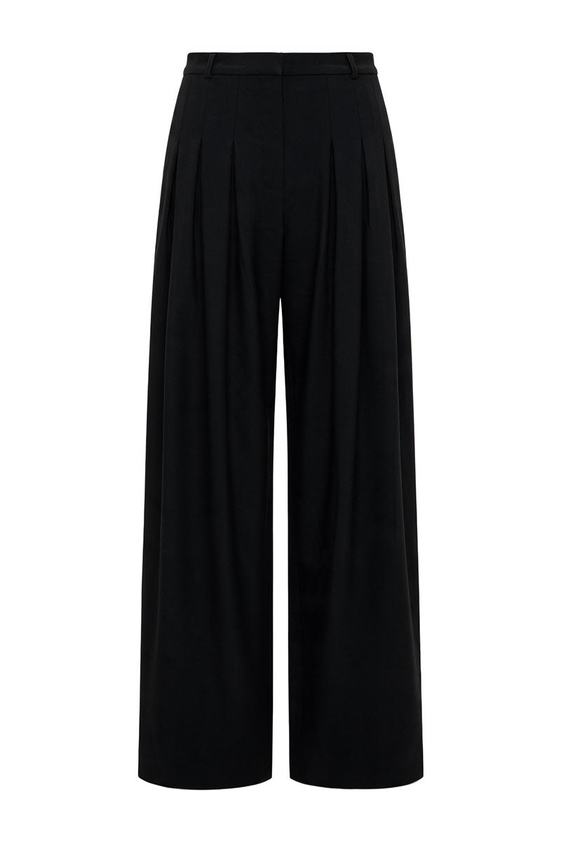 Black wide-leg wool trousers by ELENAREVA, tailored pants with a relaxed fit and smooth fabric, shown on a model.