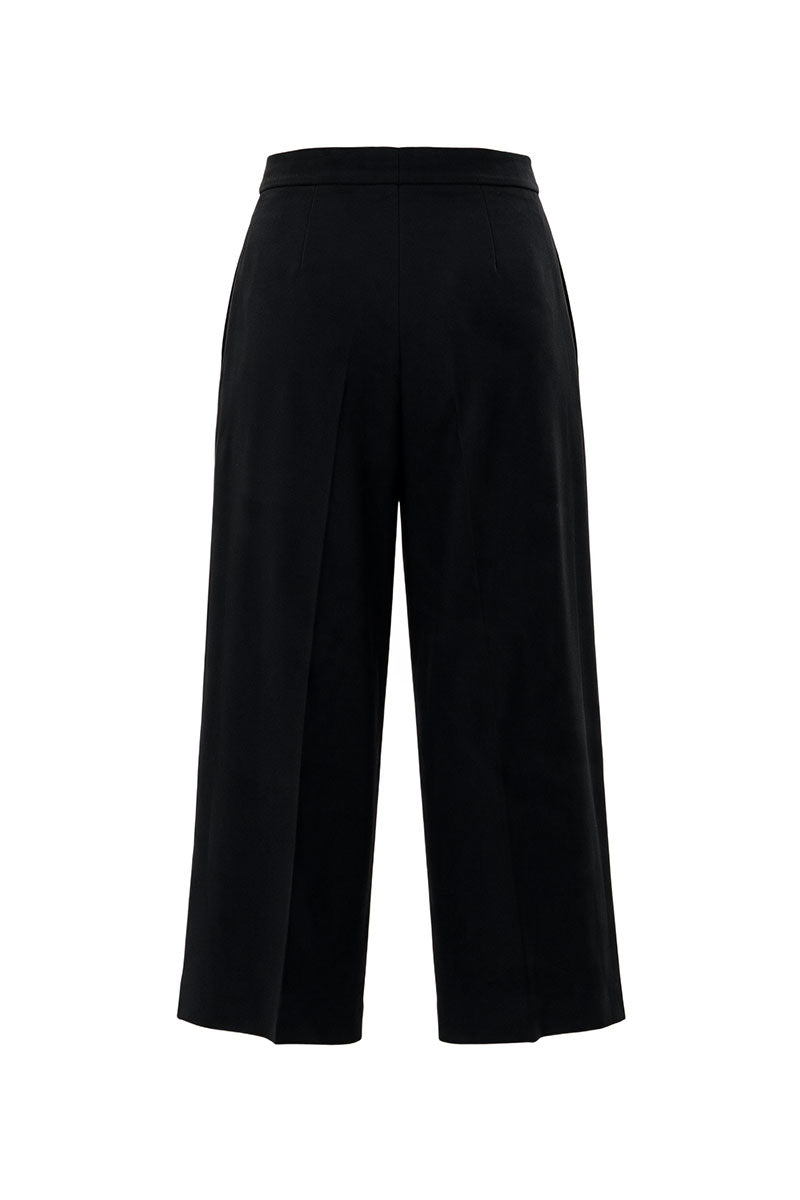 Black wool culottes pants with a silk belt from ELENAREVA, shown on a model, featuring a stylish wide-leg silhouette.