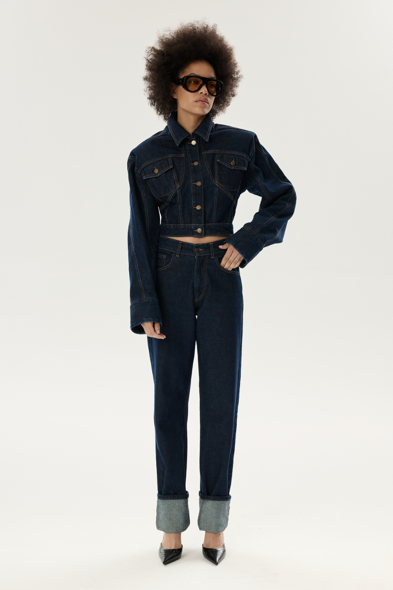 LARETAGGIO hero mid-waist straight-leg denim jeans displayed on a hanger showing classic blue denim fabric and fit.