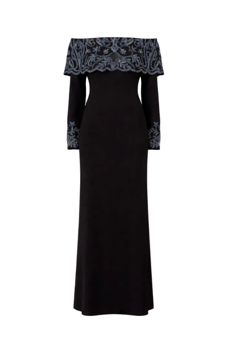 Elegant black gown by Raishma, featuring a flowing silhouette and stylish design, perfect for formal occasions.