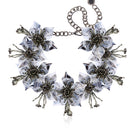 Aidan & Ice Flora Gray Necklace featuring a delicate chain and gray pendant, styled with casual and elegant outfits.