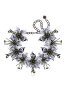 Aidan & Ice Flora Gray Necklace featuring a delicate chain and gray pendant, styled with casual and elegant outfits.