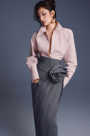 Pink New Thera shirt by Keira Tong, stylish women's shirt displayed on a hanger with a soft fabric texture.