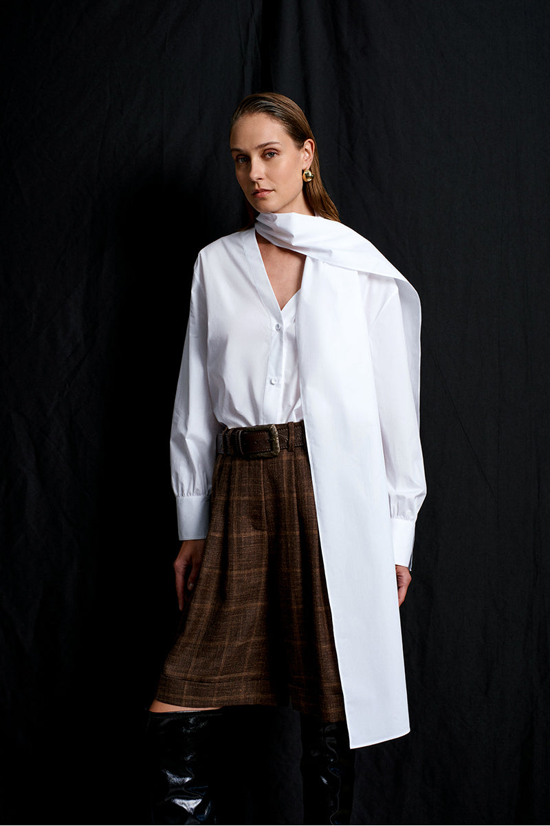 Romantic Acaria Studio shirt featuring soft fabric, stylish design, and a flattering fit, displayed on a hanger.