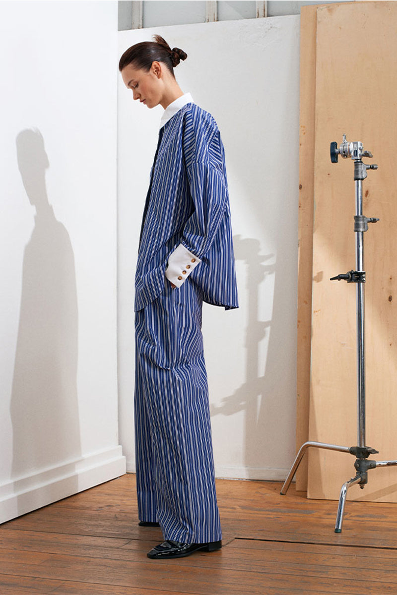 Acaria Studio New York navy and white pants laid flat showing the stylish, casual design and fabric details.