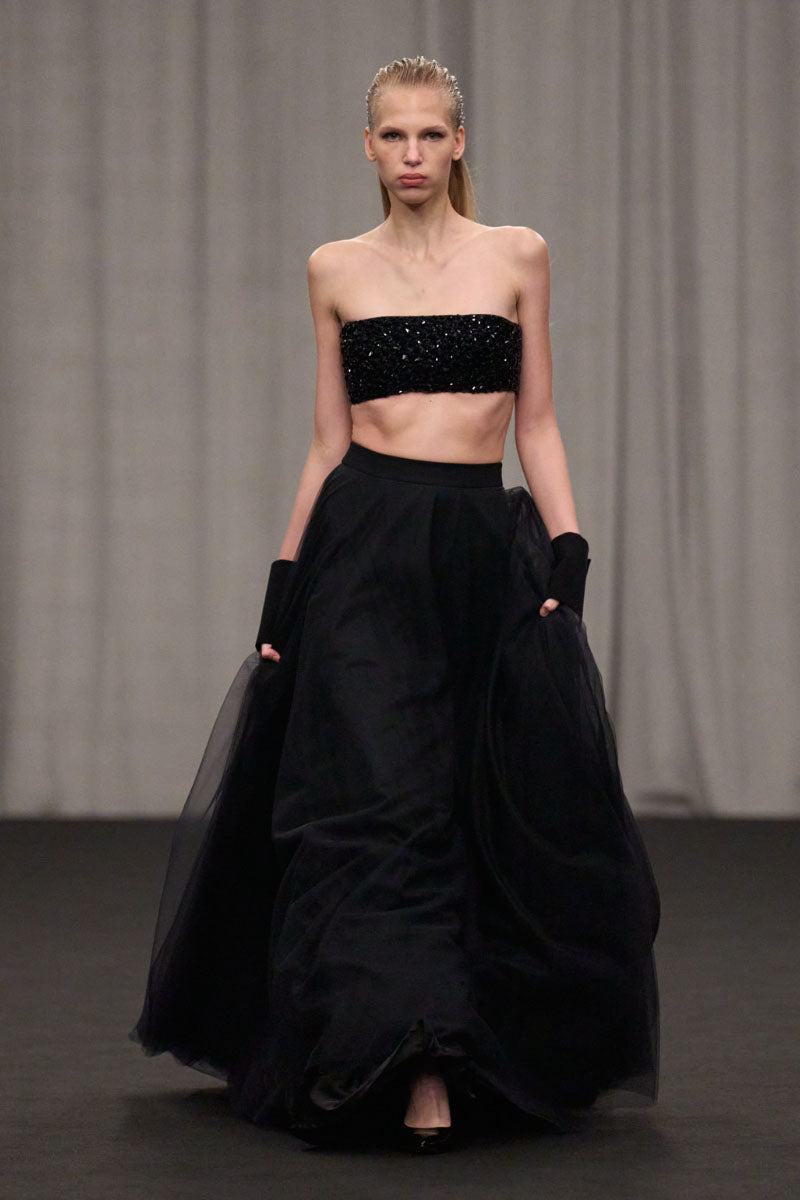 Lili Blanc crystal-embellished crop top and skirt co-ords set displayed on a model, showcasing elegant matching fashion ensemble.