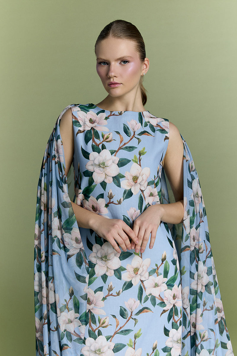 Nur Karaata Whisper Wind gown, elegant long dress with flowing fabric and delicate details, perfect for formal occasions.