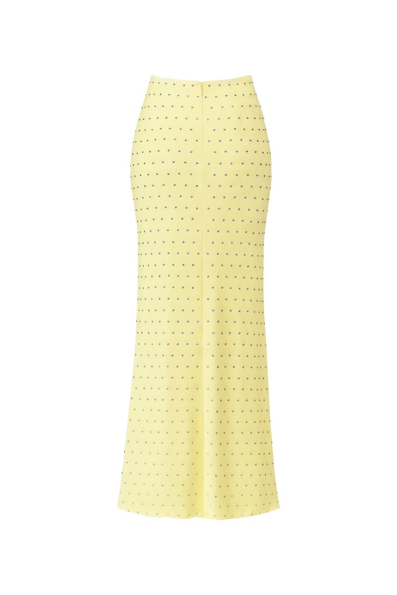 Nazlı Ceren Haley long jersey maxi skirt in lemonade, flowing fabric with a relaxed fit and high waist, displayed in natural light.