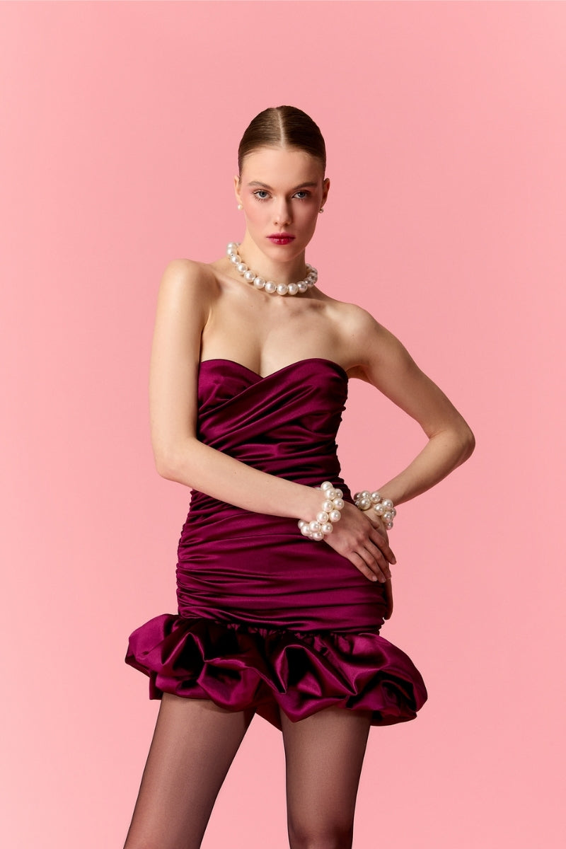 Nur Karaata MIA Mini Dress displayed on a model, showcasing the stylish, fitted design and vibrant color of this trendy mini dress.