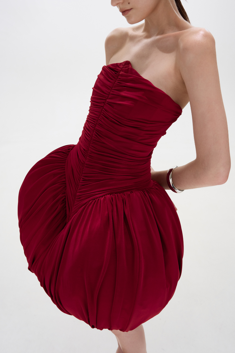 BalYKINA Clara Burgundy Mini Dress displayed on a mannequin, showcasing its stylish design and vibrant color.