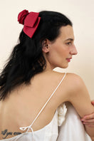 Two Tuscan Rose Bow Silk Hair Clips by Not Just Pajama, showcasing elegant pink silk bows for stylish hair accessories.