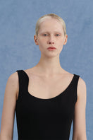 Black asymmetrical-beck sleeveless jumpsuit by JINSUN featuring a modern, stylish design with a relaxed fit.
